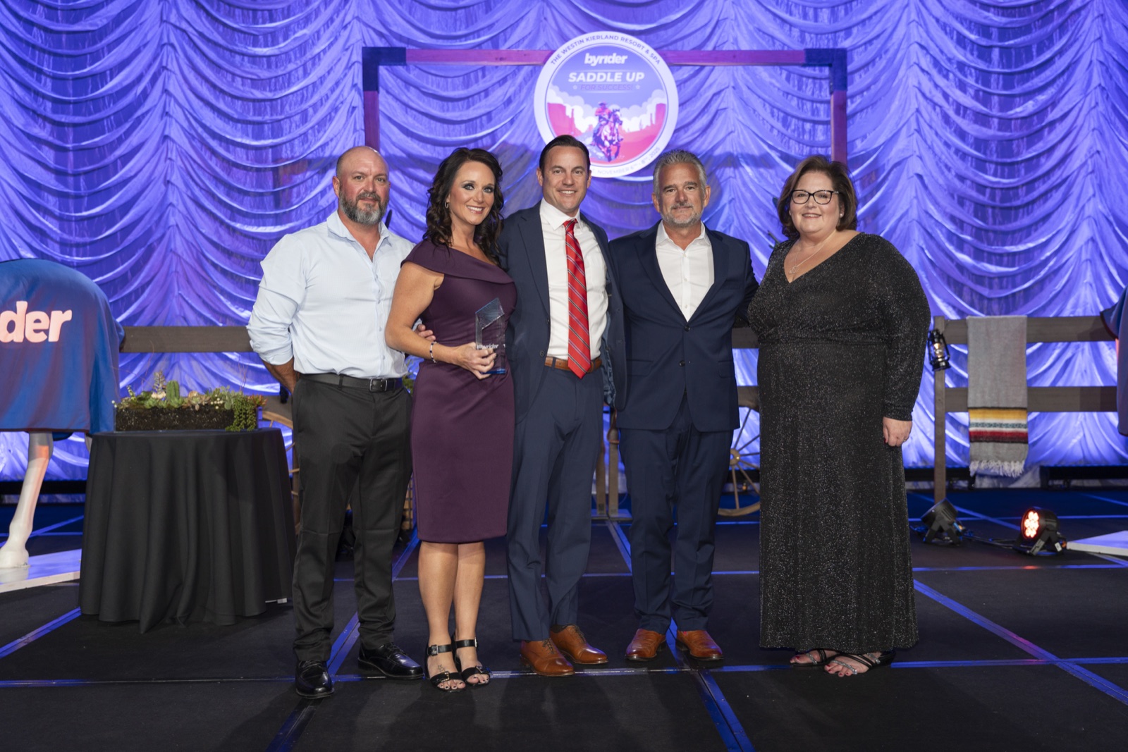 Byrider franchisees with award at Saddle Up convention